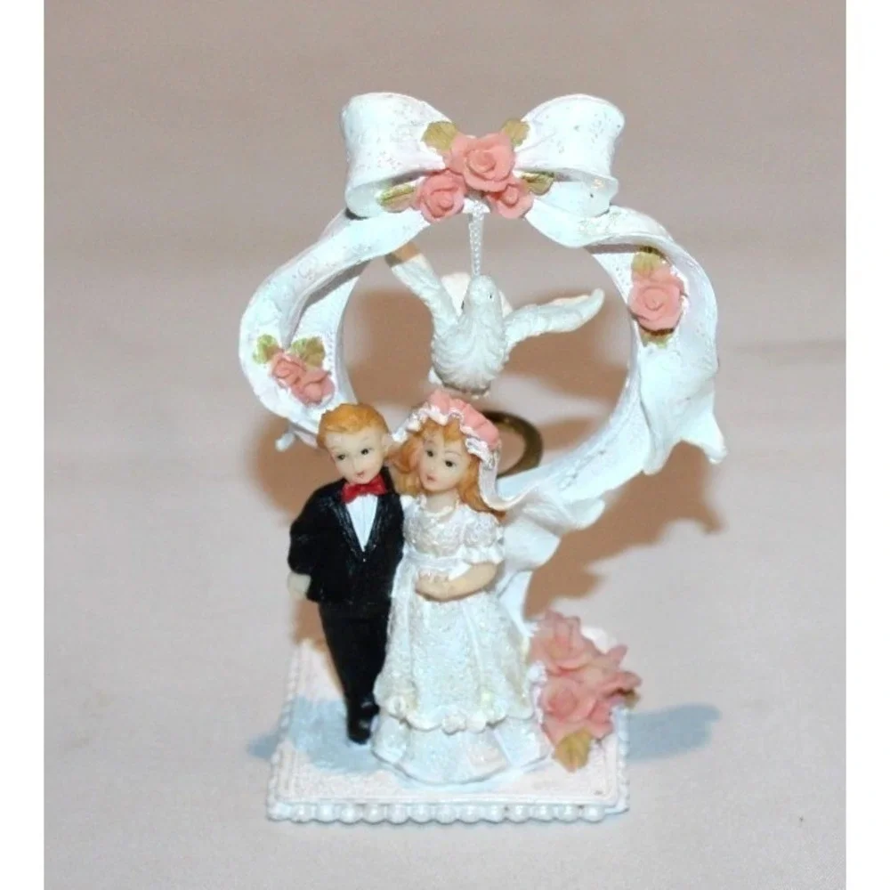 vintage bride & groom wedding cake topper with dove & ring in back